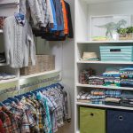 Inspired Closets walk in closet with shelves for clothes and other belongings and clothing racks