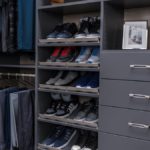 Clothing hung on racks and shoes placed on shelves