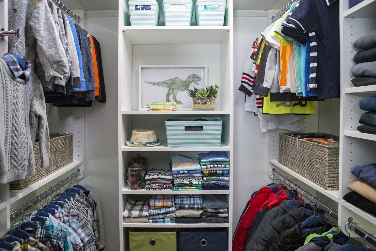 Inspired Closets walk in closet with shelves and clothing racks