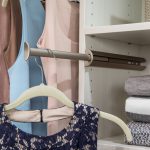 Close up of article of clothing hung on pulled out clothing rack