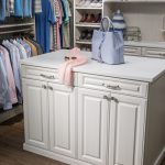 Boutique closet with cabinets in the center