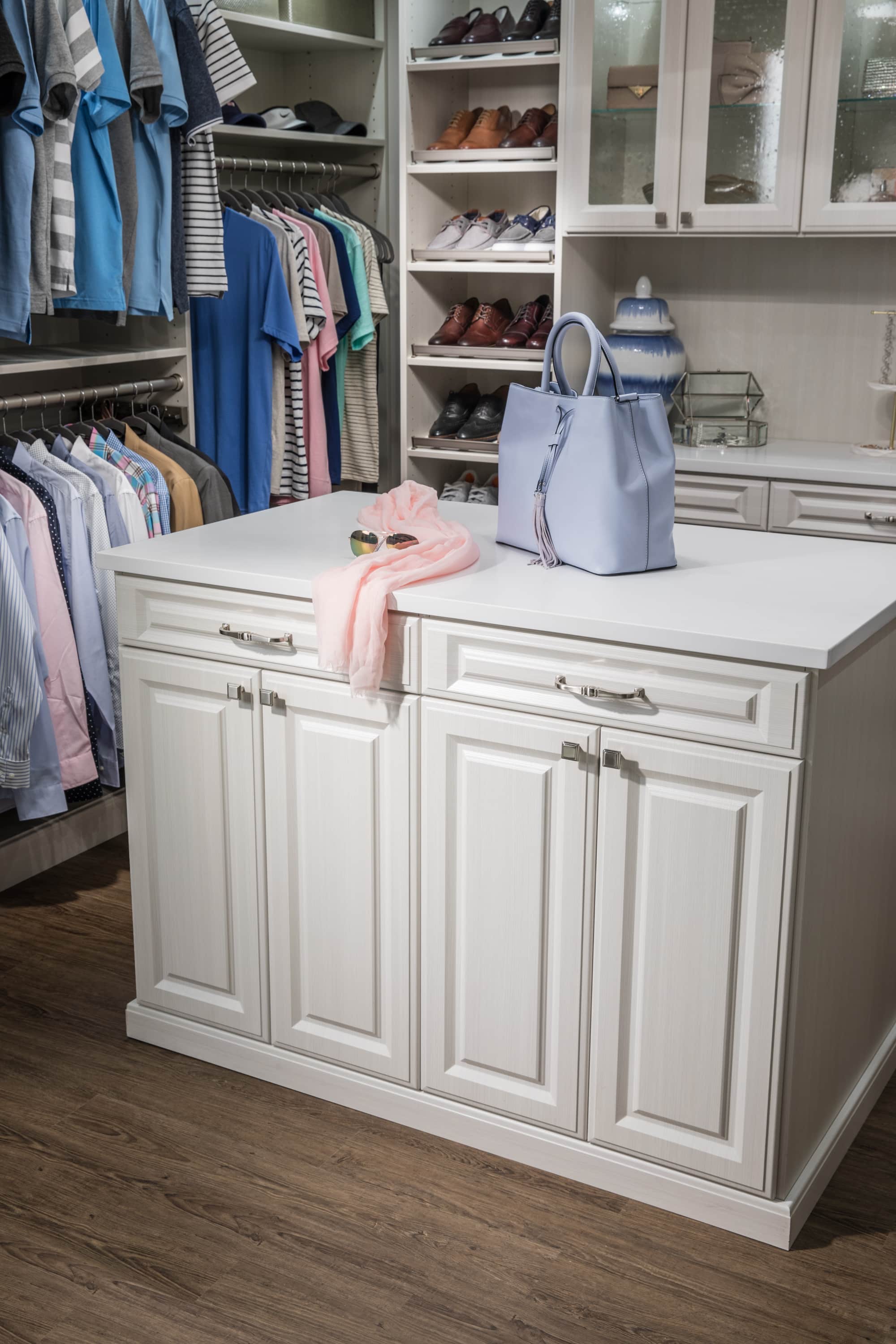 Boutique closet with cabinets in the center