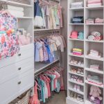 Girls walk in closet with clothing on racks and shelves