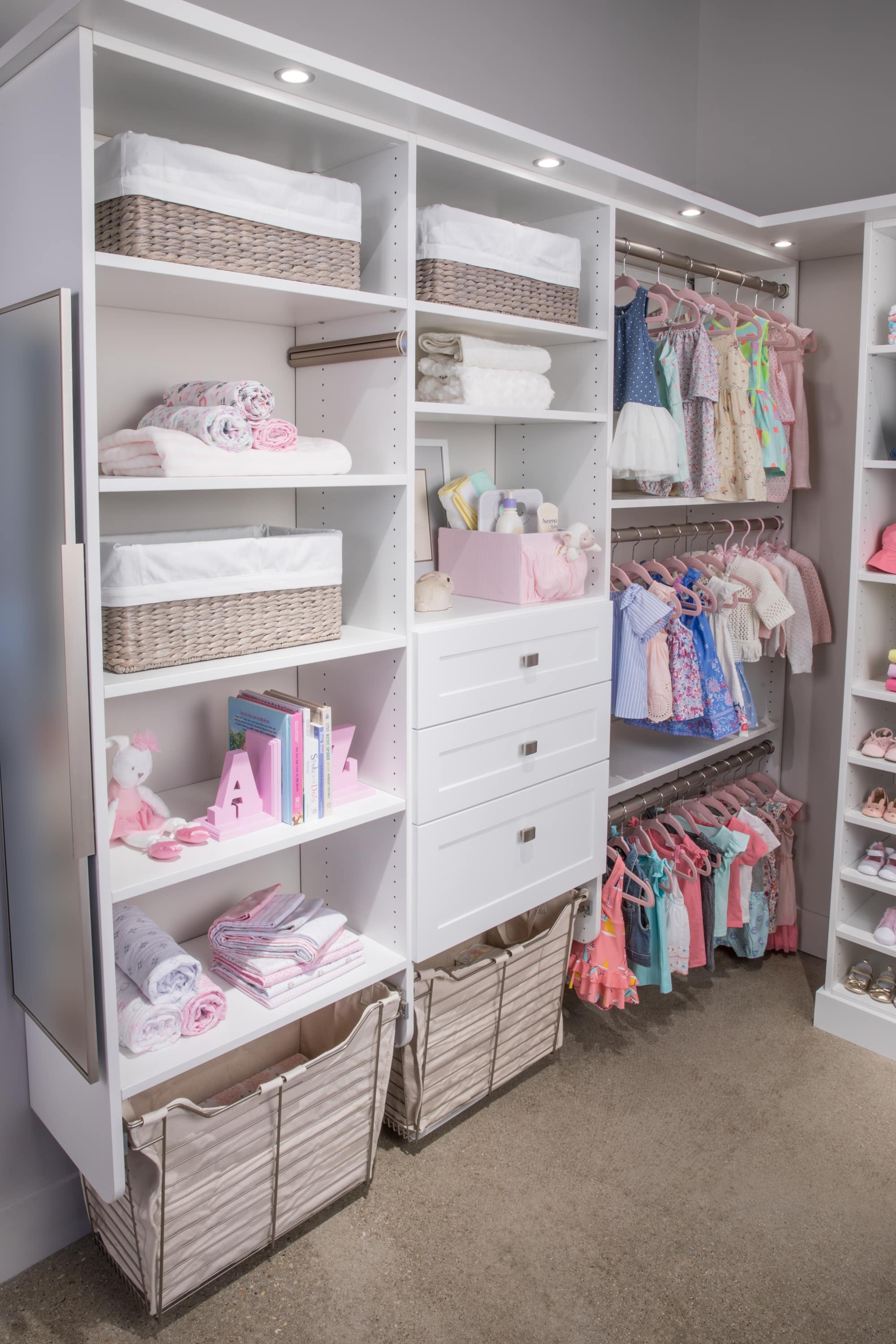 Walk in girls closet filled with clothing