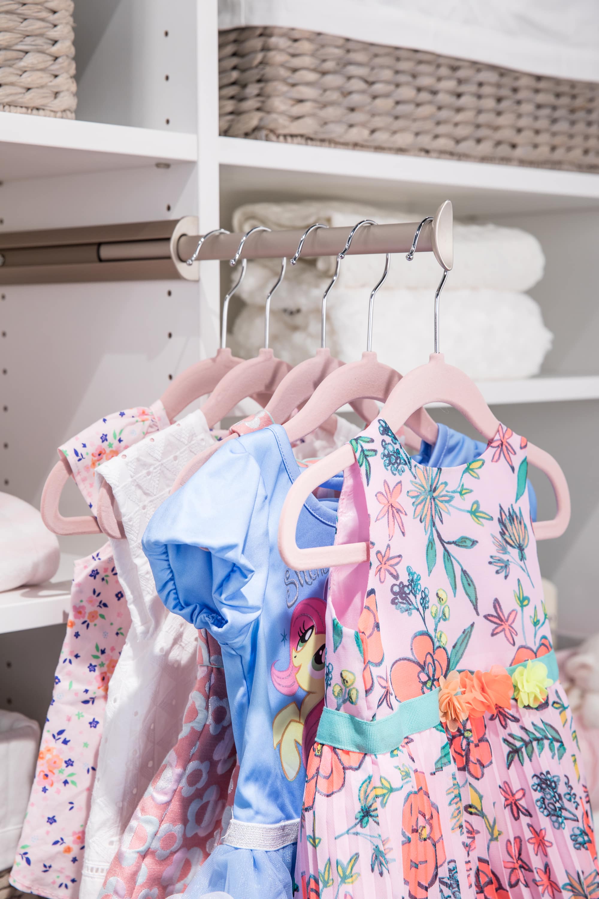 Girls clothing hung on clothing rack