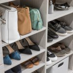 Shelves in walk in closet with shoes