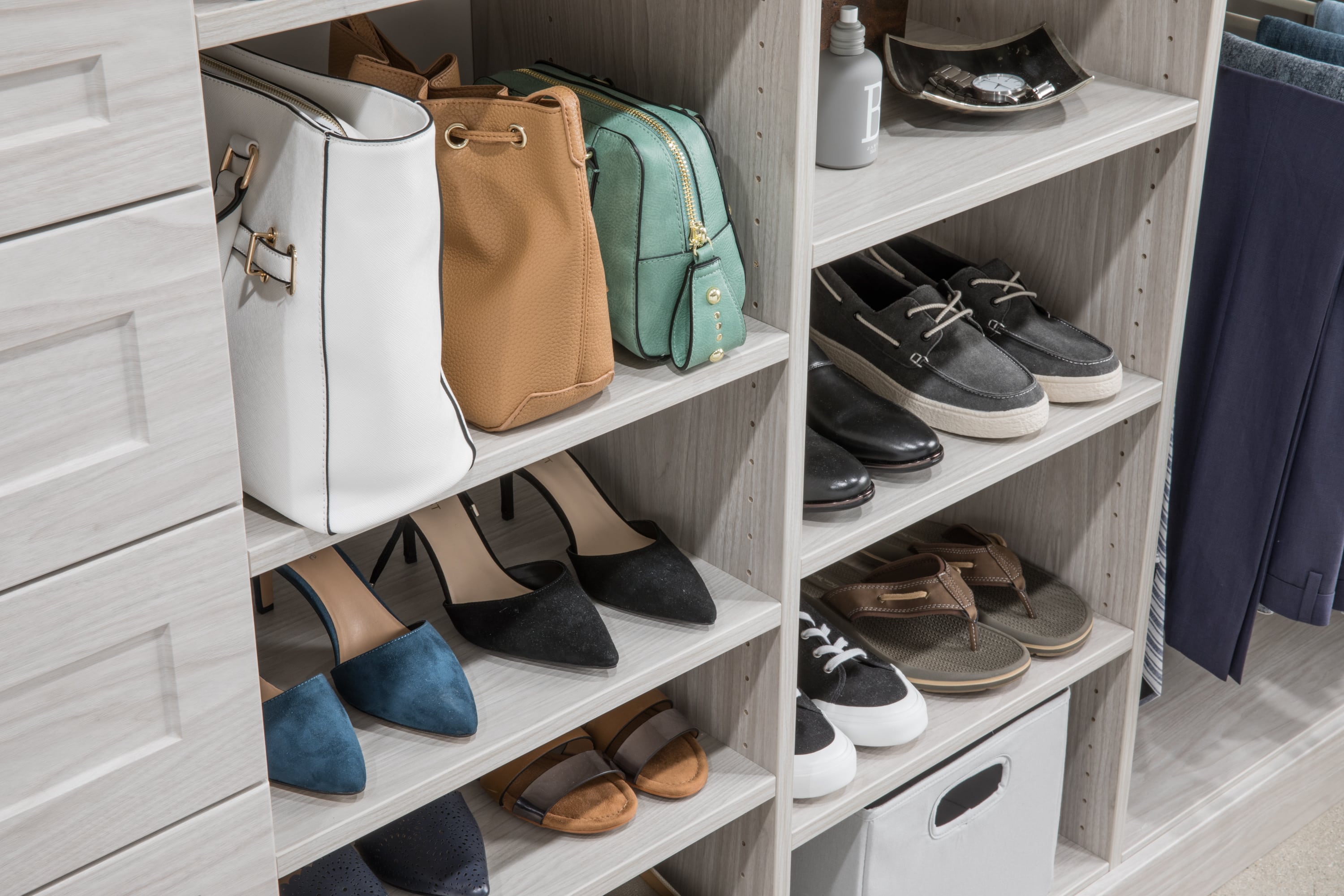 Shelves in walk in closet with shoes