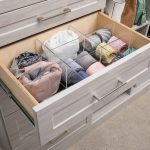Open drawer with clothing articles inside