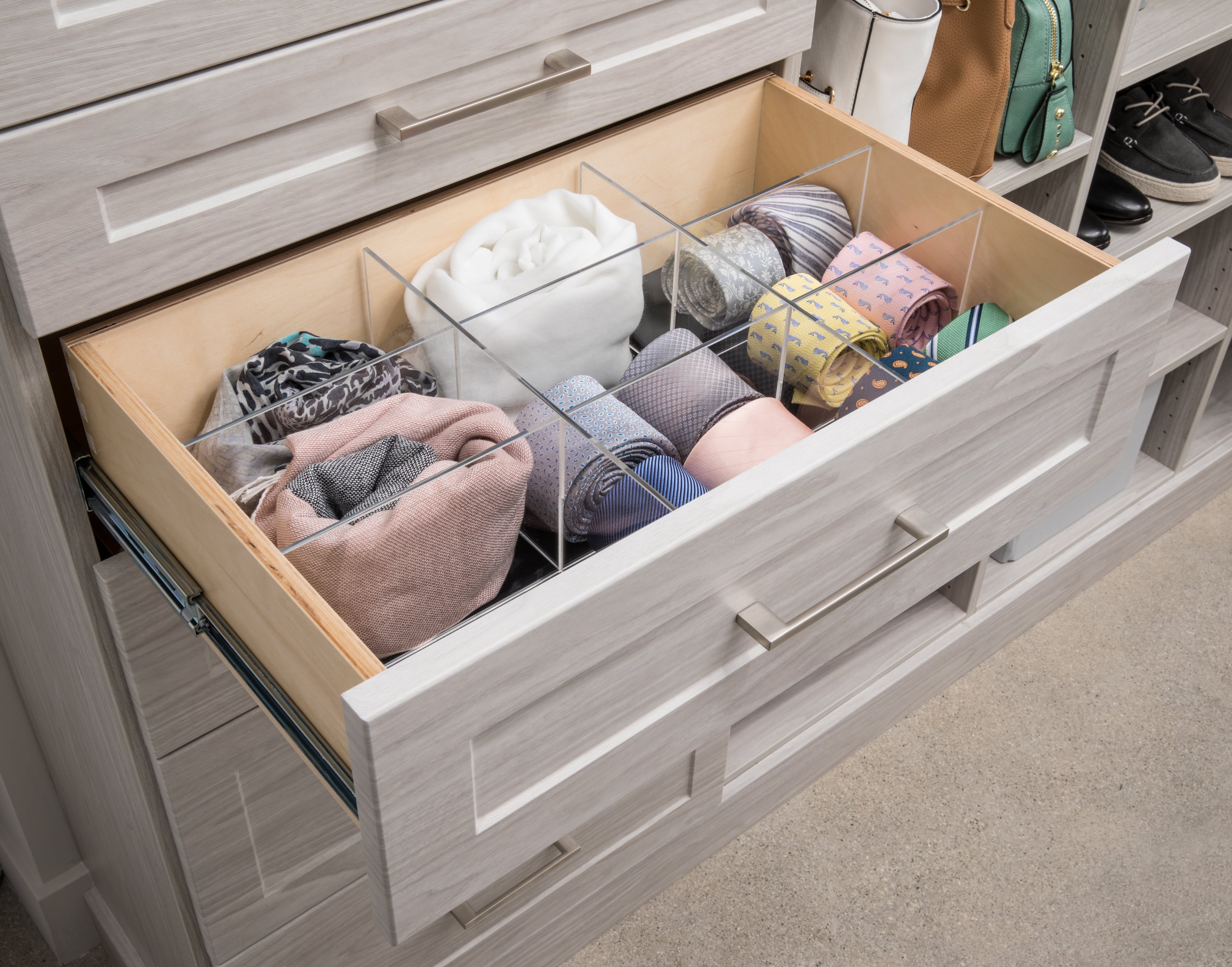 Open drawer with clothing articles inside