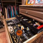 Inspired Closets boutique custom closet systems with open drawer showing belongings inside
