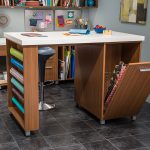 Craft room desk with space for wrapping paper and other articles