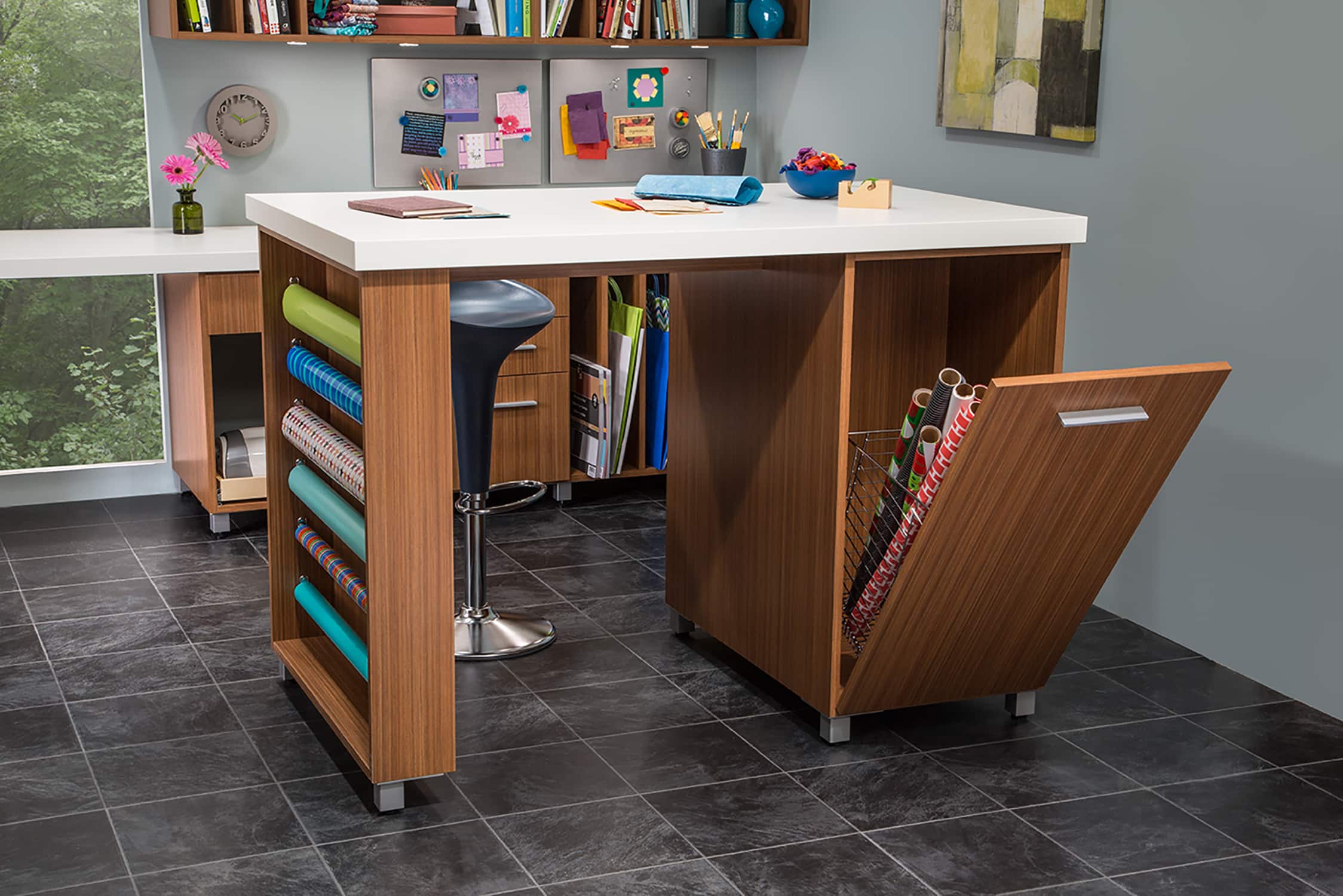 Craft room desk with space for wrapping paper and other articles