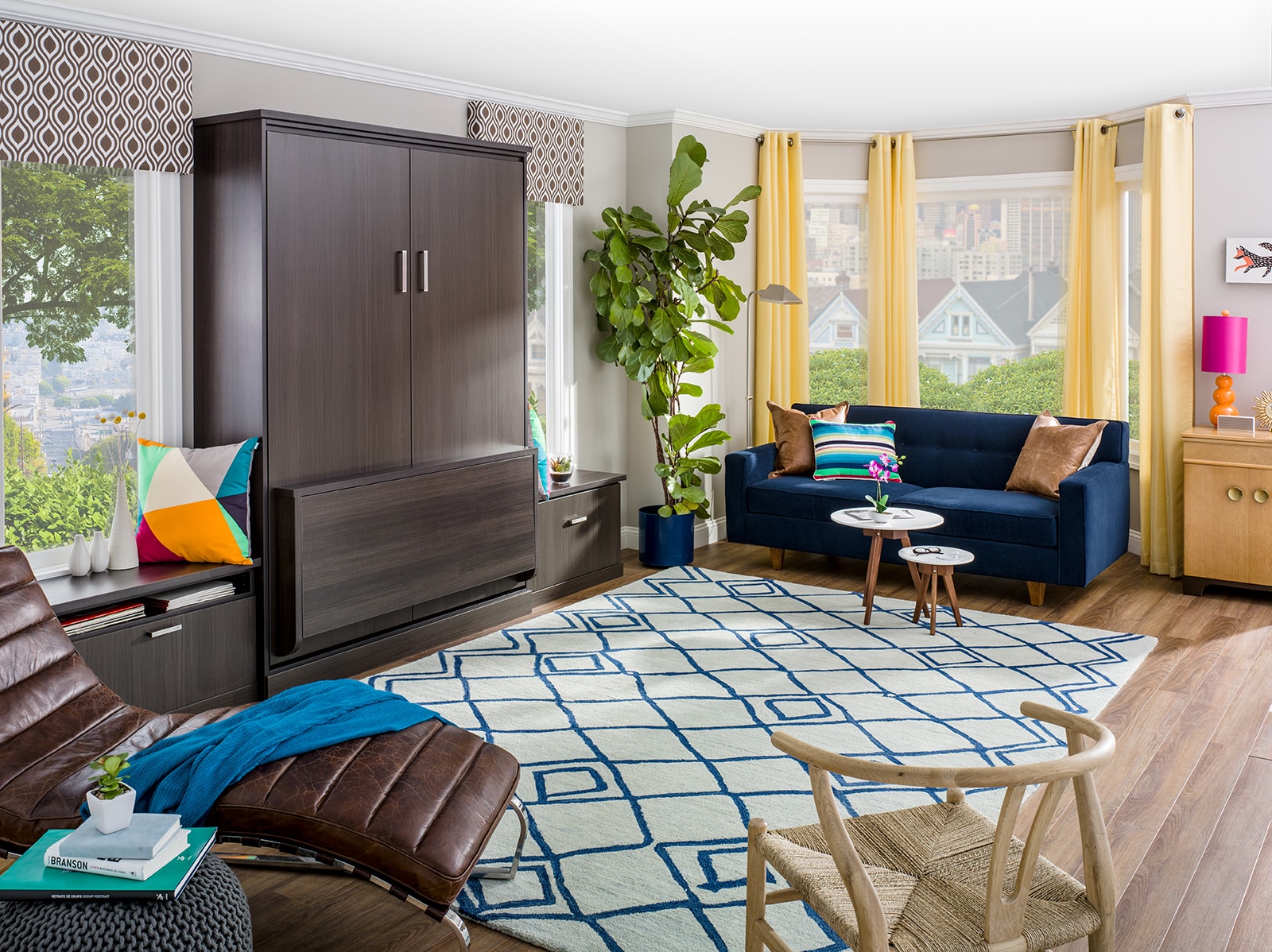 Bedroom full of furniture and murphy bed folded up against wall