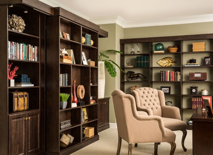 Office with murphy bed folded up and items on each shelf