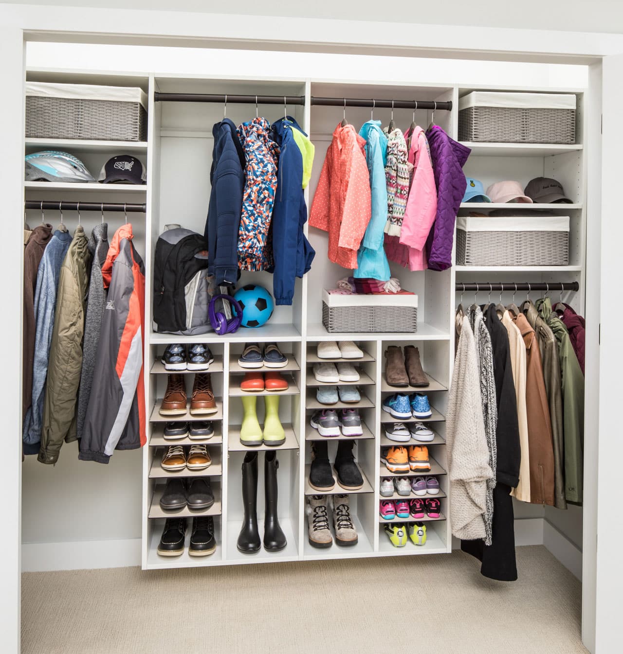 Closet filled with shoes, coats and other accessories