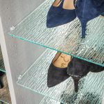 Close up of women's shoes on glass shelves