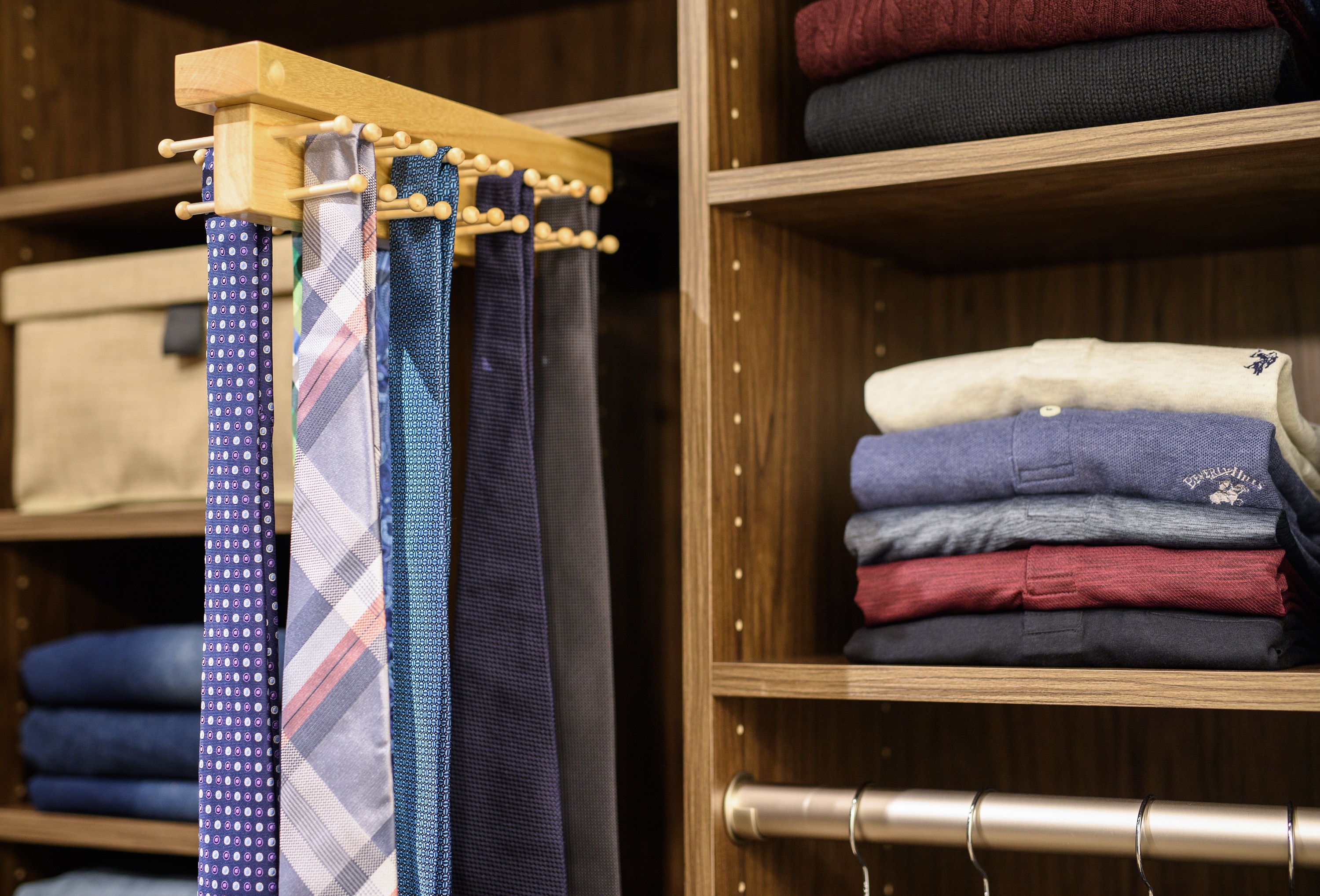 Reach in closet featuring tie rack