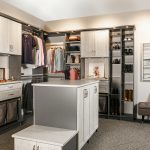 Side view of closet showing shelves, clothing racks and drawers