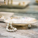 Close up of jewelry in small plate