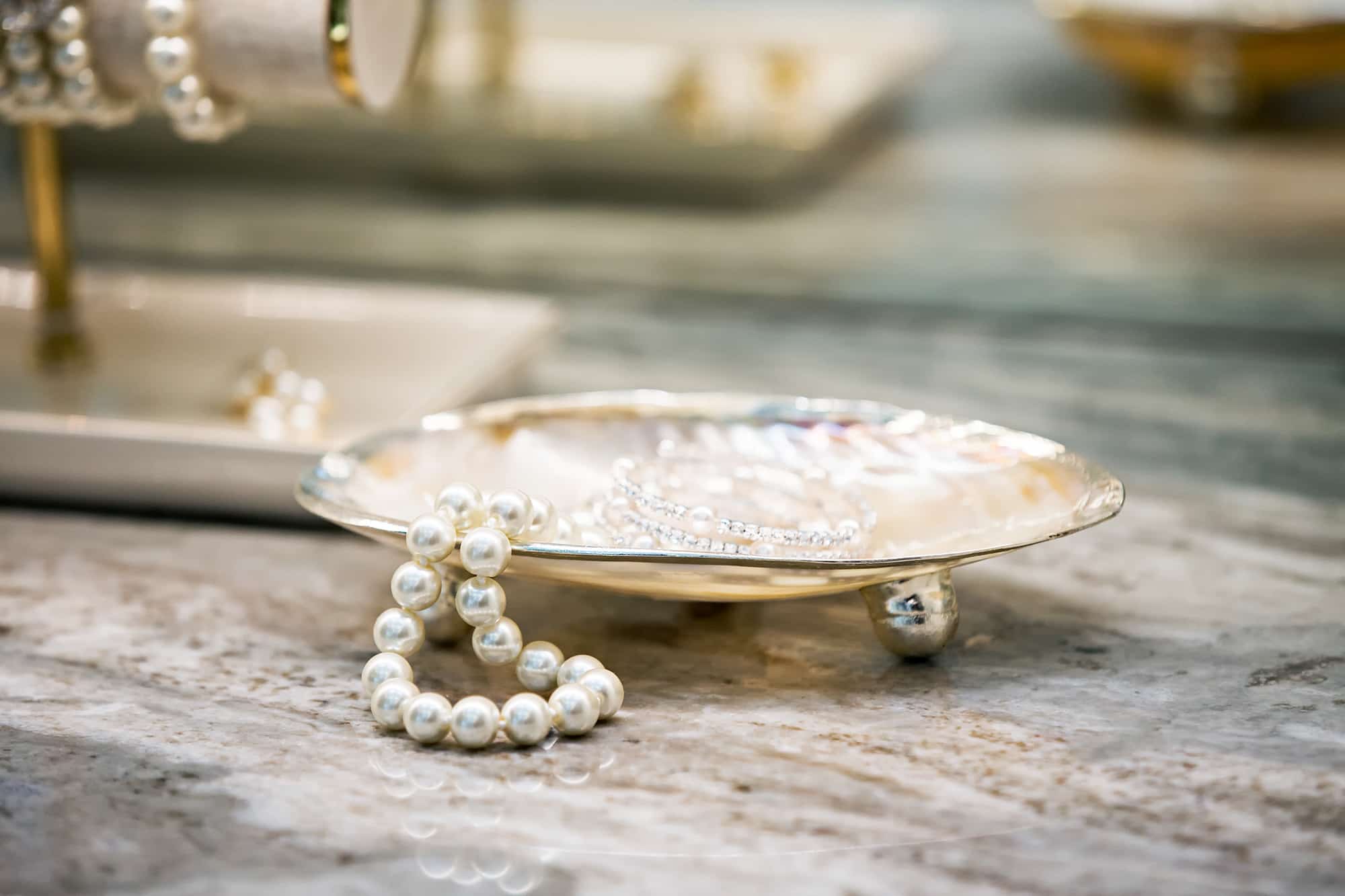 Close up of jewelry in small plate