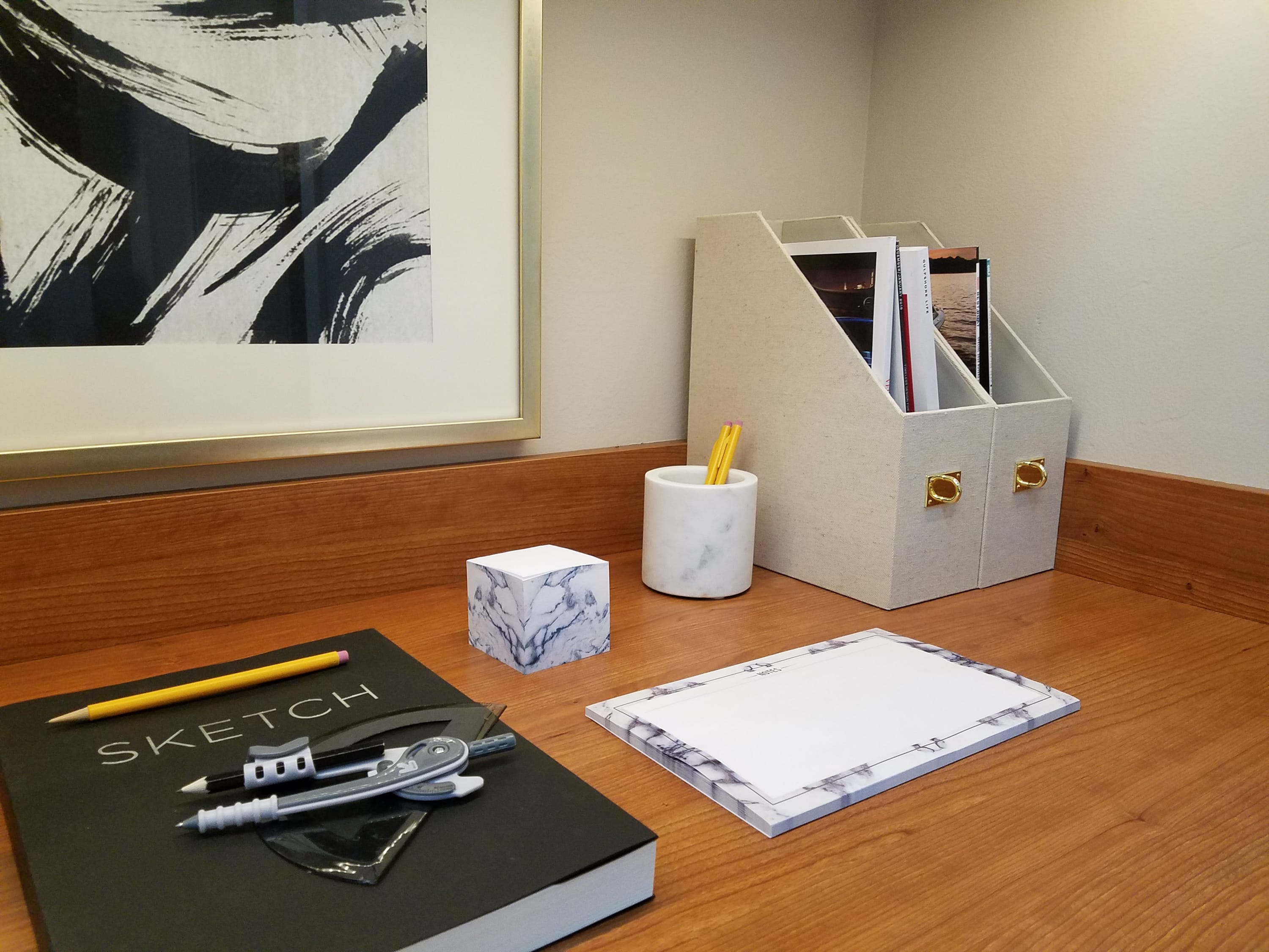 Close up of home office desk with belongings on top