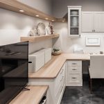 Home office with desk, drawers and cabinets with belongings