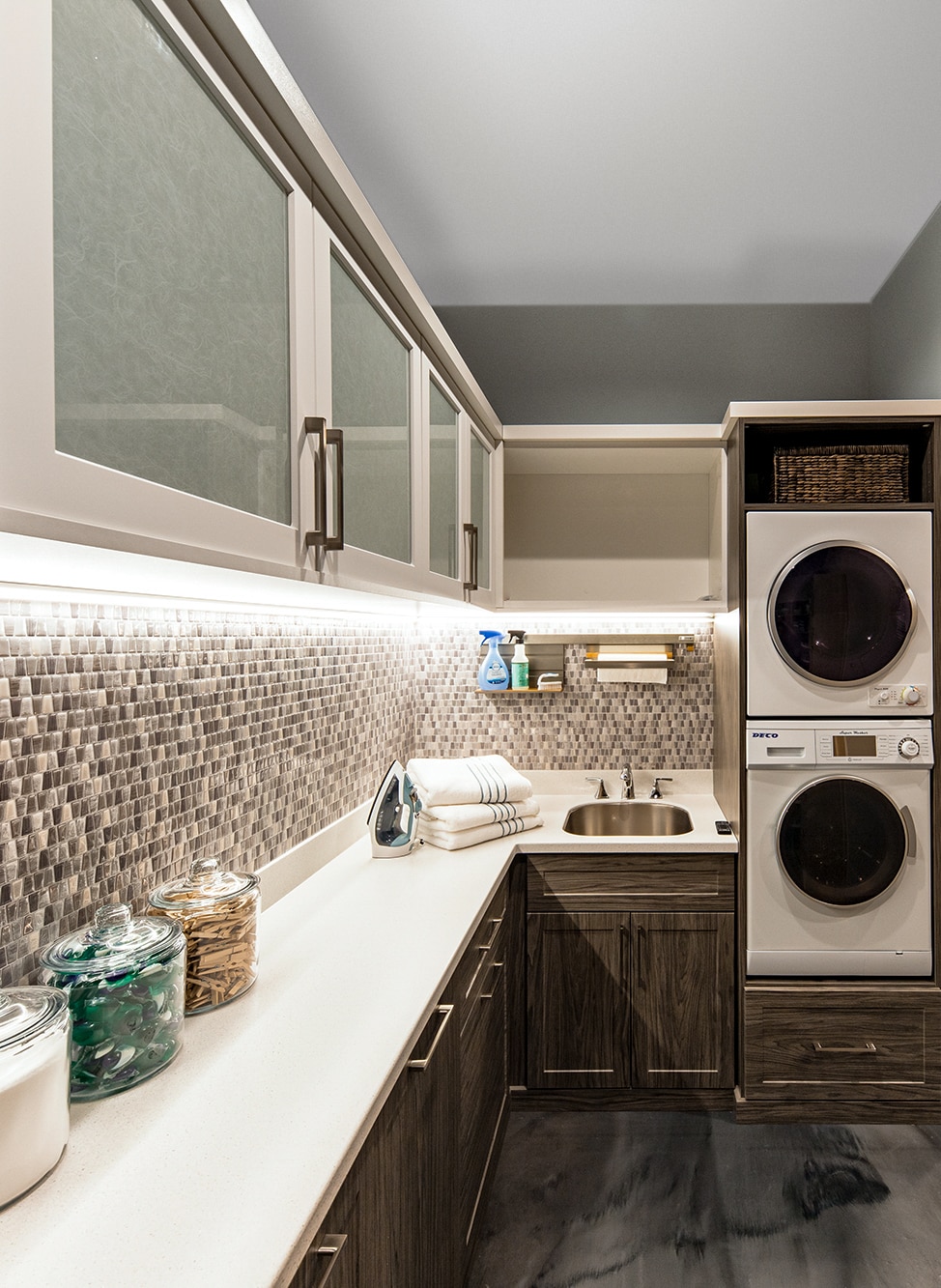 Laundry room with cabinets and space for washer and dryer