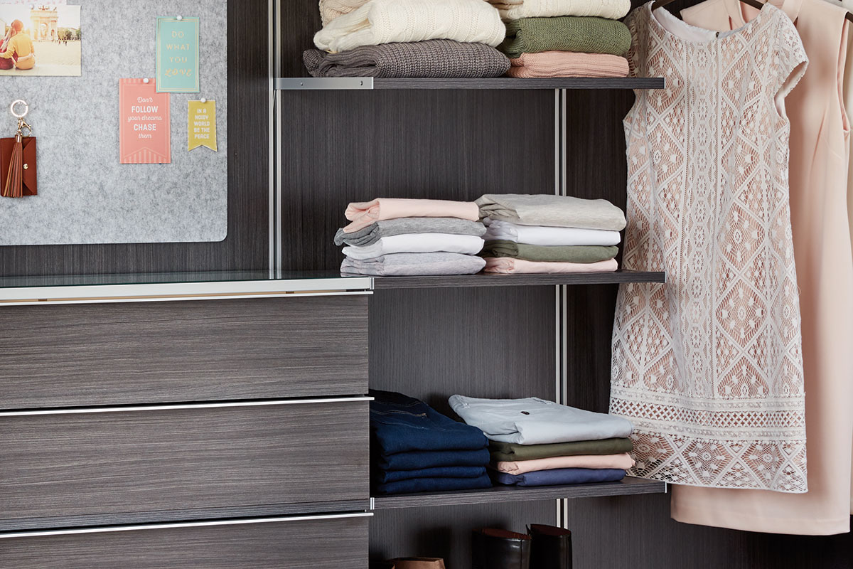 Inspired Closets Shelves with Clothing on Them