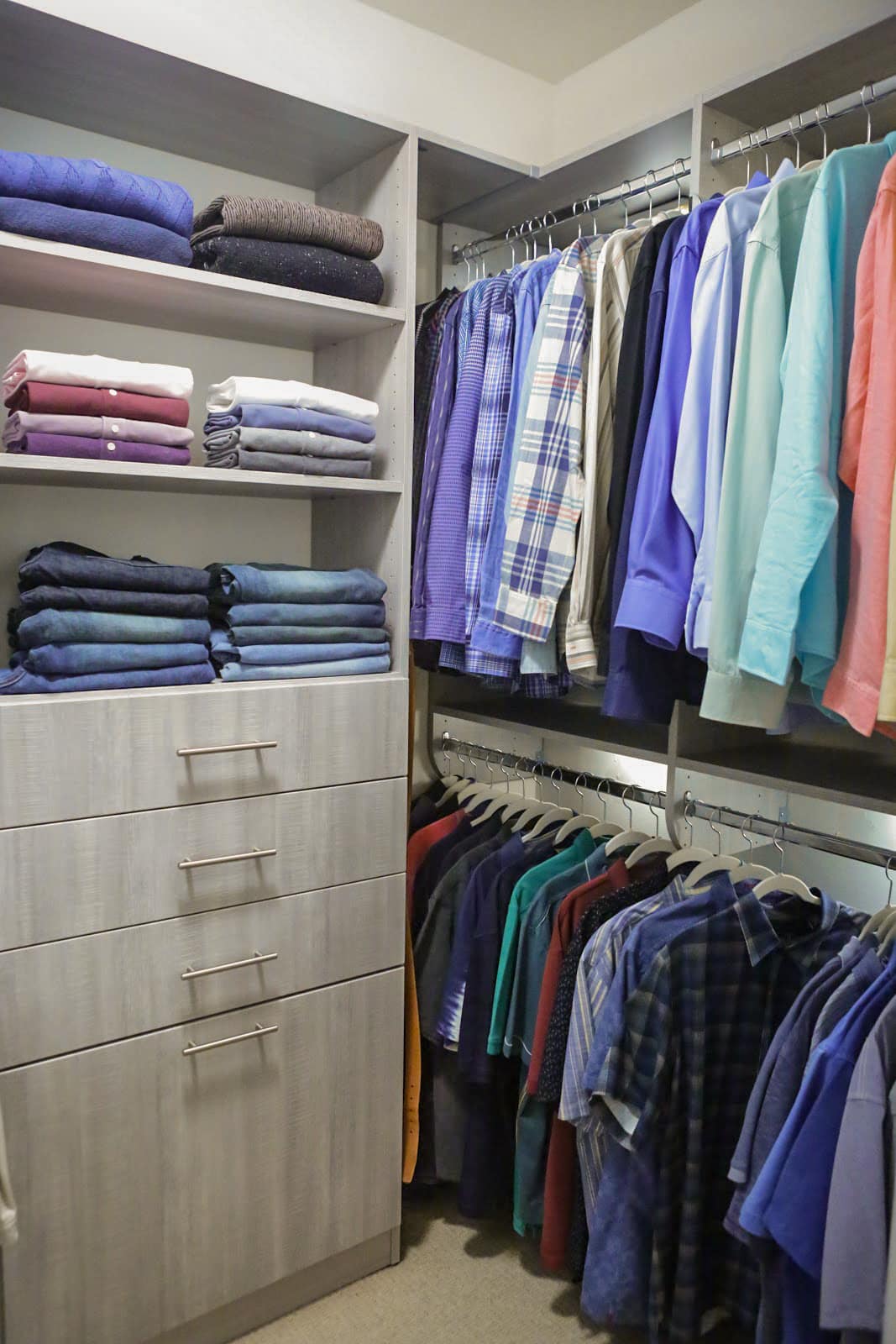 Close up of Inspired Closets closet with shelves, drawers and a clothing rack
