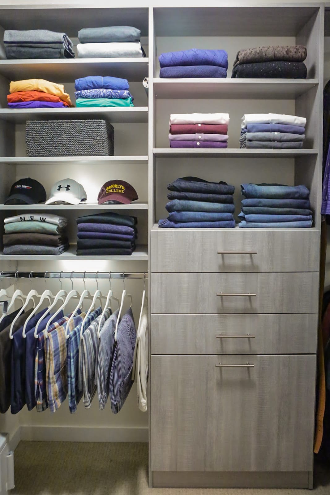 Close up of Inspired Closets closet with shelves, drawers and a clothing rack