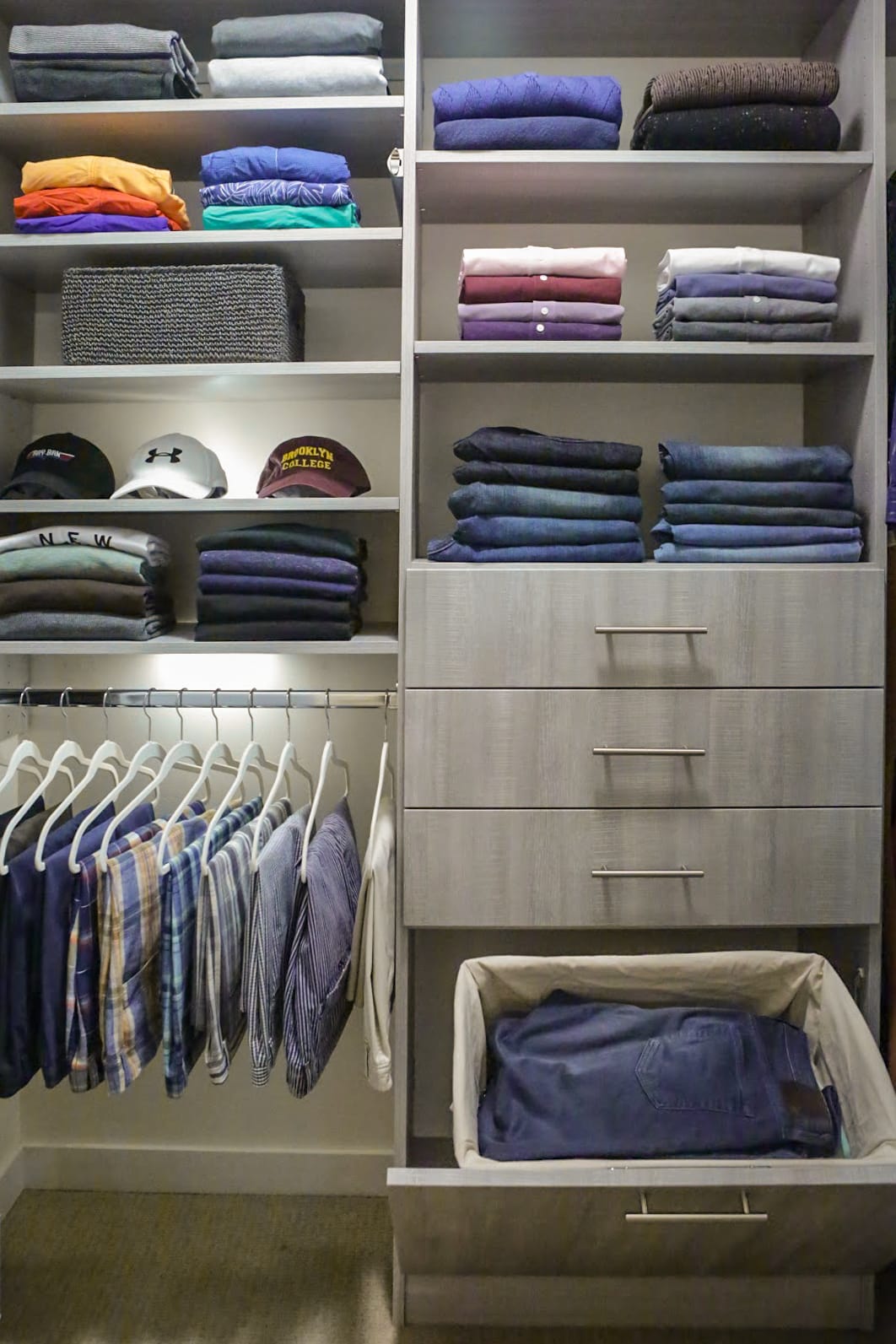Close up of Inspired Closets closet with drawers , shelves and a clothing rack