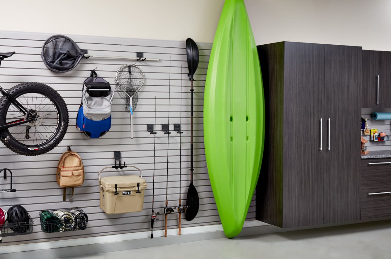 Inspired Closets closet in garage with wall racks