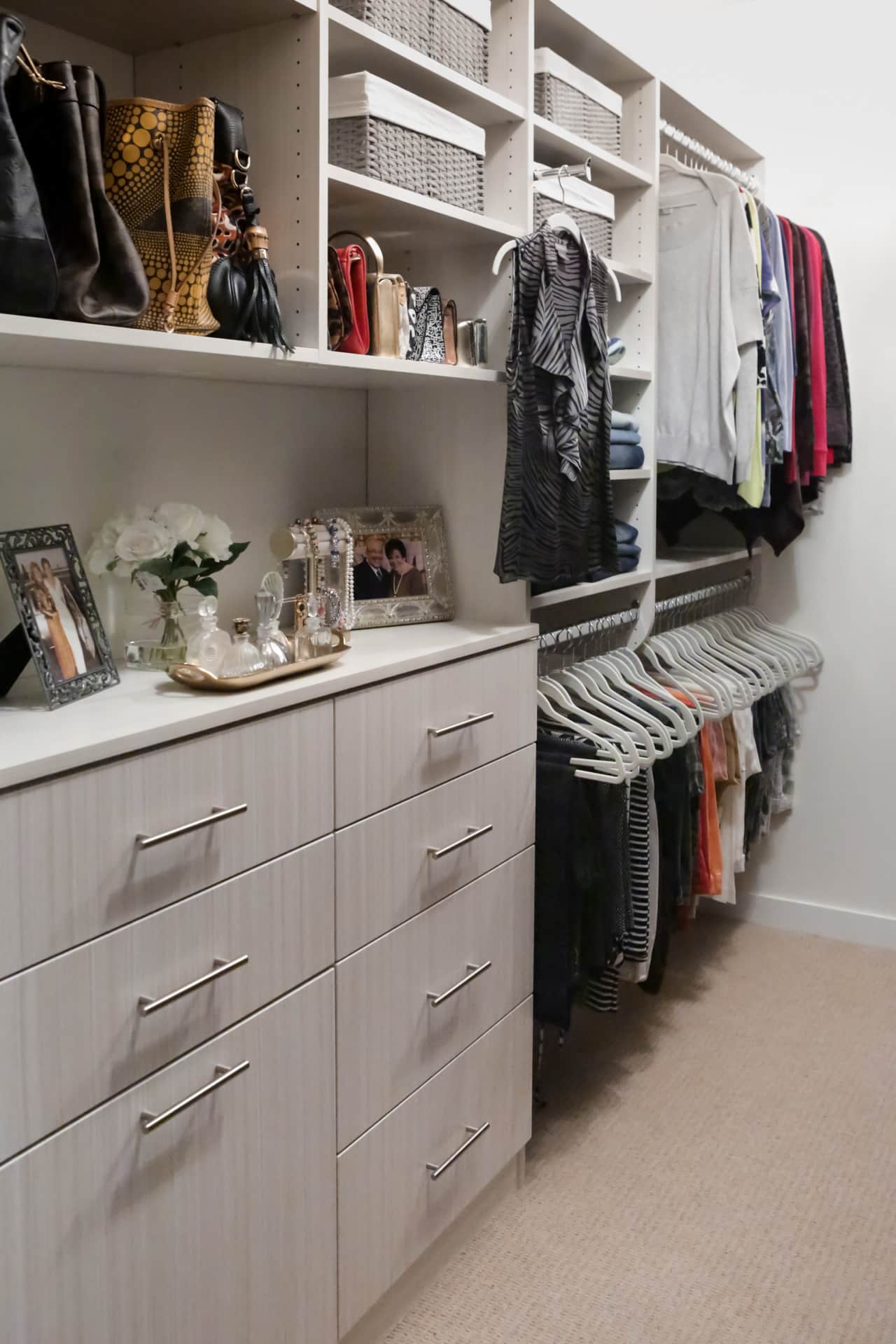 Inspired Closets closet with shelves, drawers and clothing racks