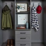 Closet showing items on hooks and shelves