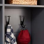 Shirt and cap hanging on closet hook