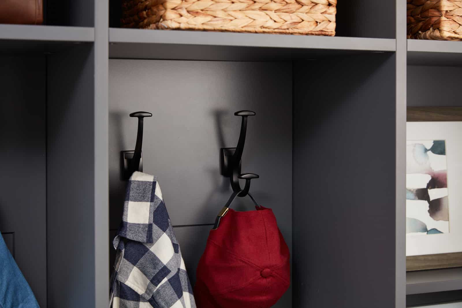 Shirt and cap hanging on closet hook