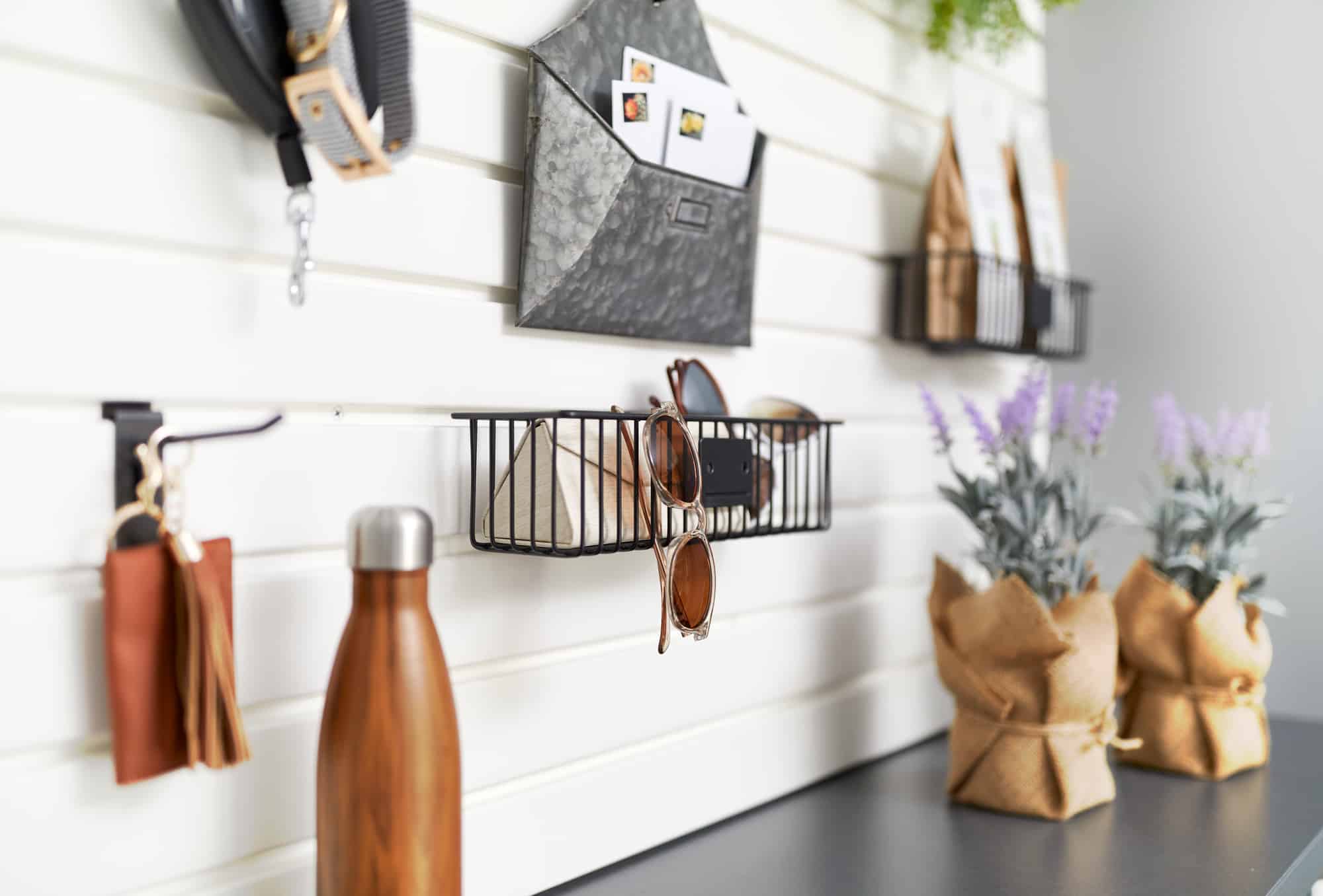 Custom Garage Storage with Sliding Cabinets, Slatwall and Hanging Accessories