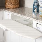 Pull our ironing board for custom built laundry room cabinets