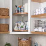 White lazy susan in a corner shelf for a custom laundry storage
