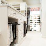 Custom white boutique closet island with drawers and pant storage in Oklahoma city