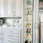 Beautiful floor mounted closet with glass door wardrobe and pull out drawers in Sacramento