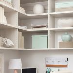 White custom built home office with corner shelving from Inspired Closets