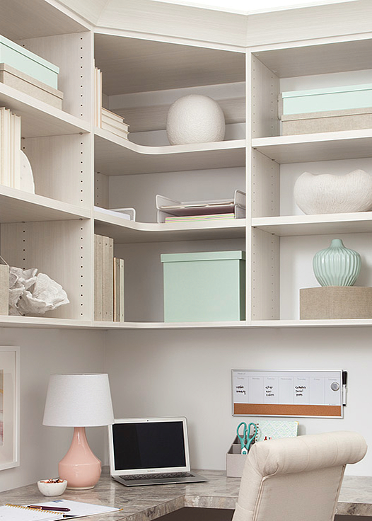 White custom built home office with corner shelving from Inspired Closets