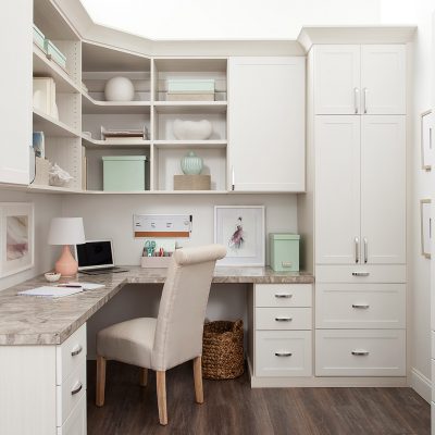 White custom built home office with drawers and storage hutch from Inspired Closets