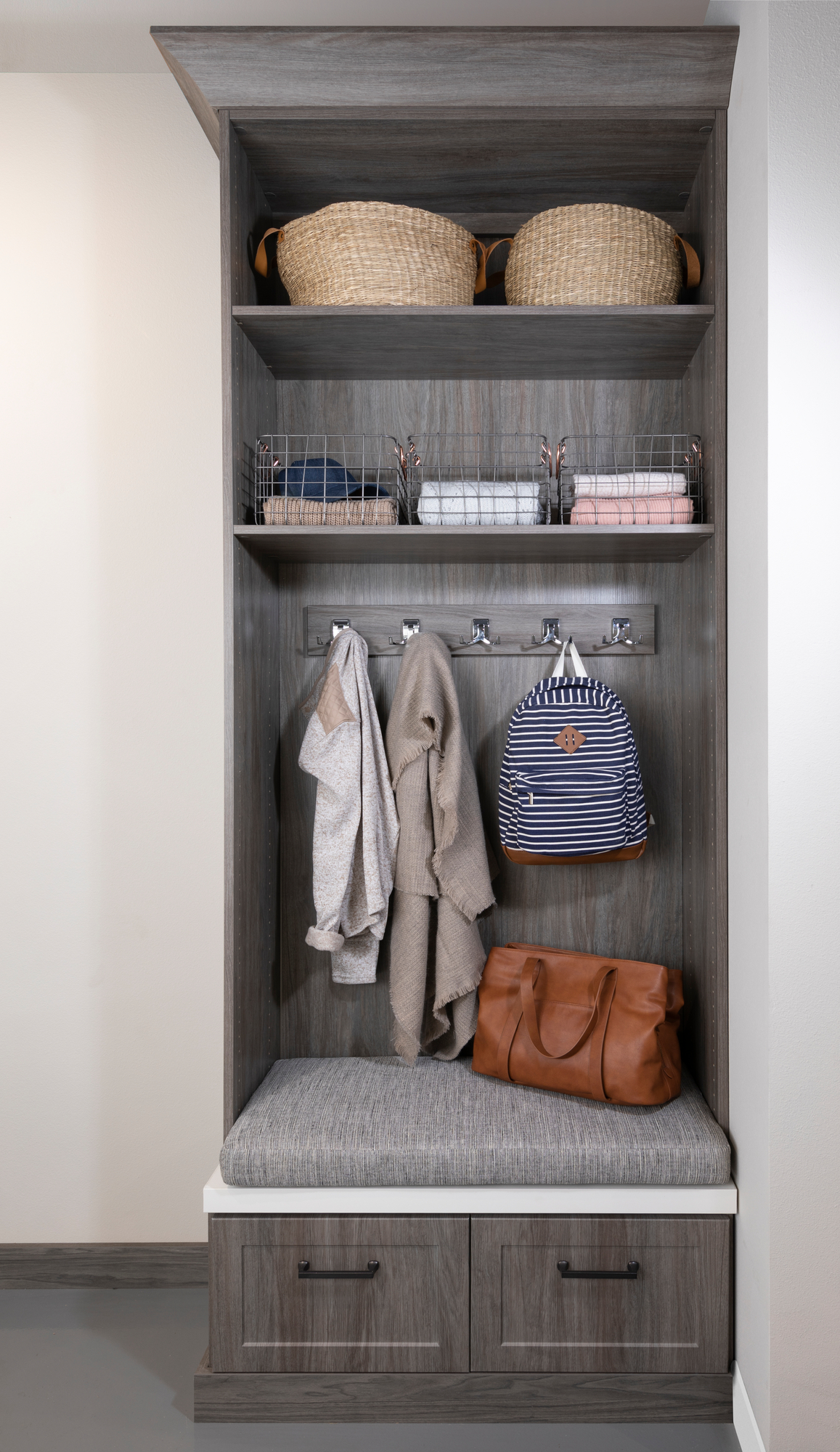 Custom driftwood entryway with bench from Inspired Closets