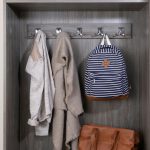 Custom driftwood entryway with hanging storage from Inspired Closets
