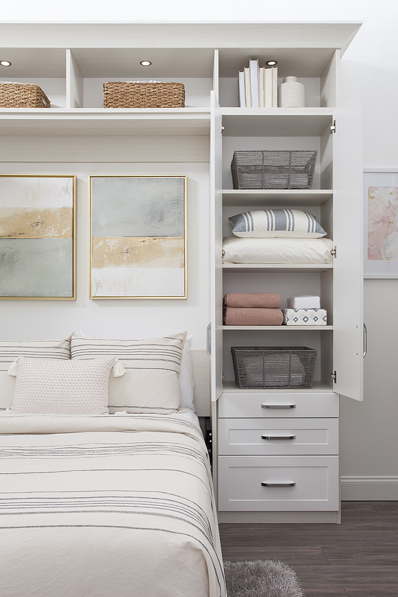 White Custom murphy bed with shelving with hutch and drawers from Inspired Closets