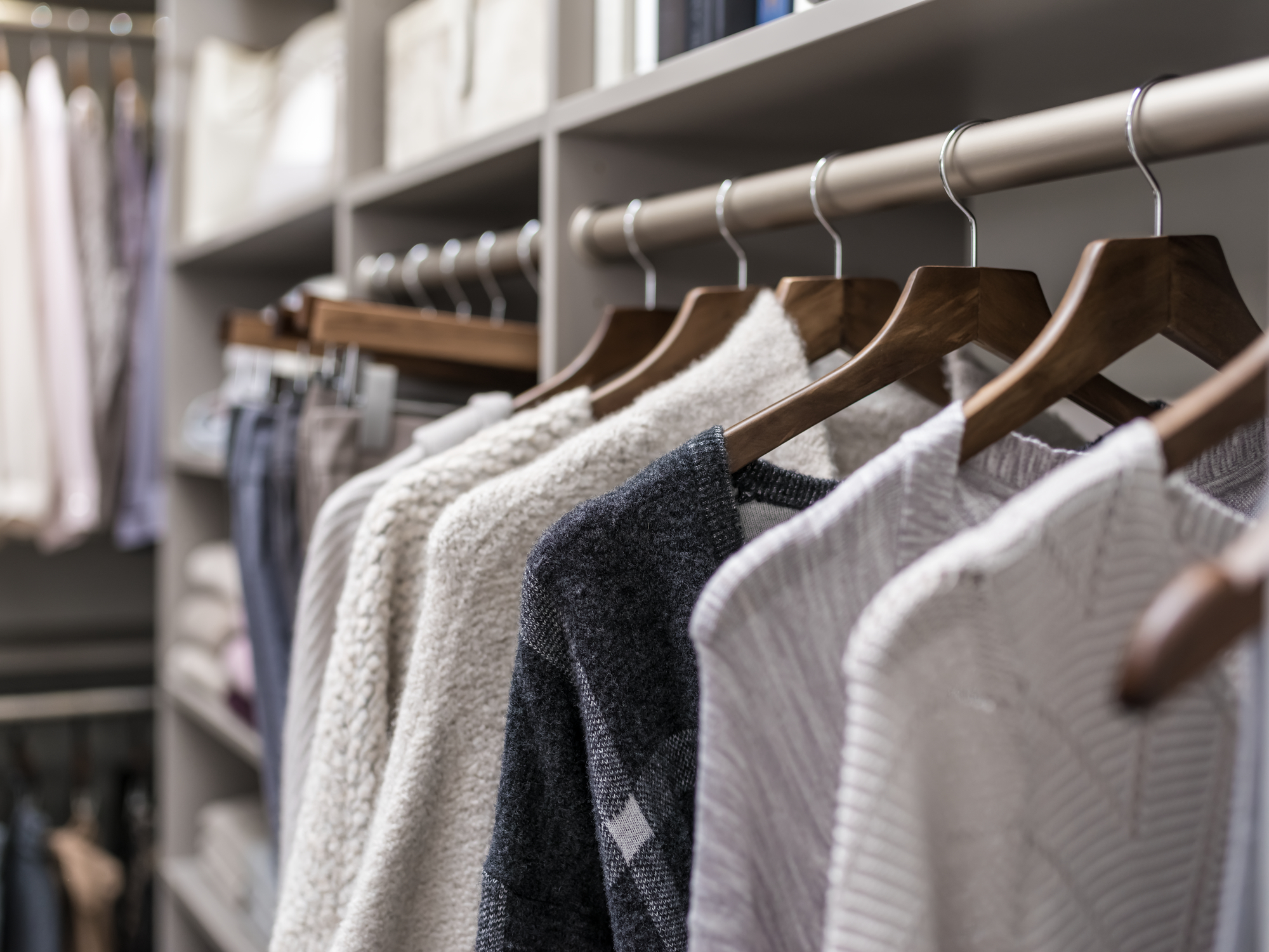 Custom storage organization by hanging and folding your cloths by Inspired Closets