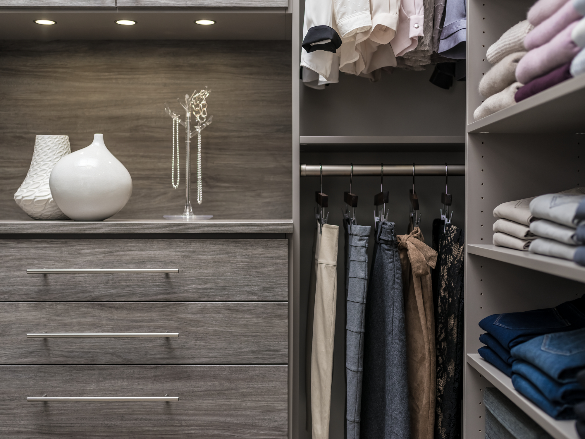 Hanging your pants or fold your sweaters with a custom closet from Inspired Closets