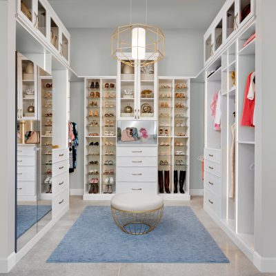 Custom boutique closet in houghton with shoe shrine shelving and mirror doors